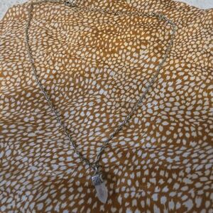 Quarts tip.selver pendent with Cresent moon detail and silver chain.